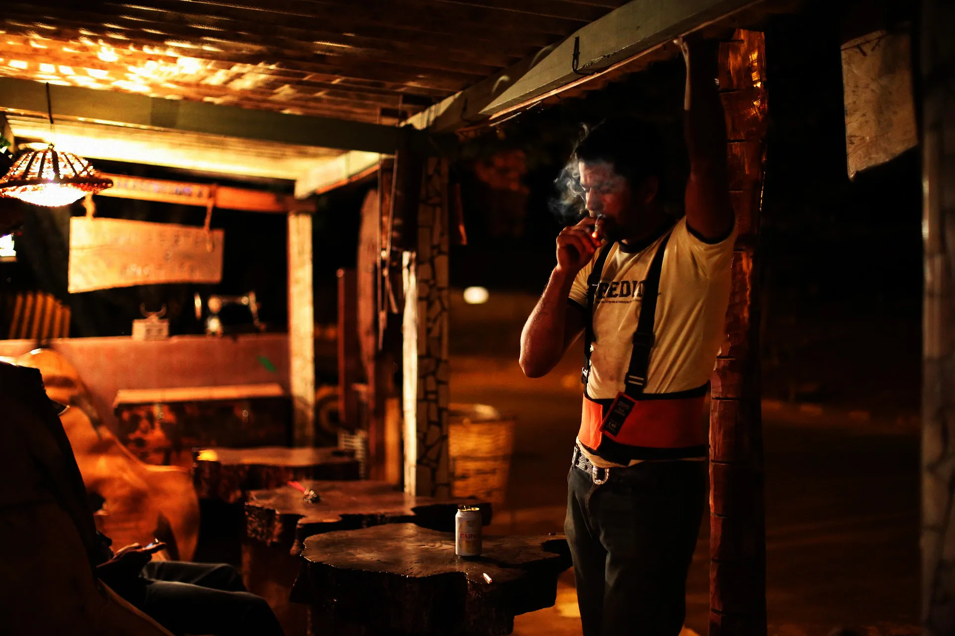 Farm hand João half-watches the match at his local in Martinesia
